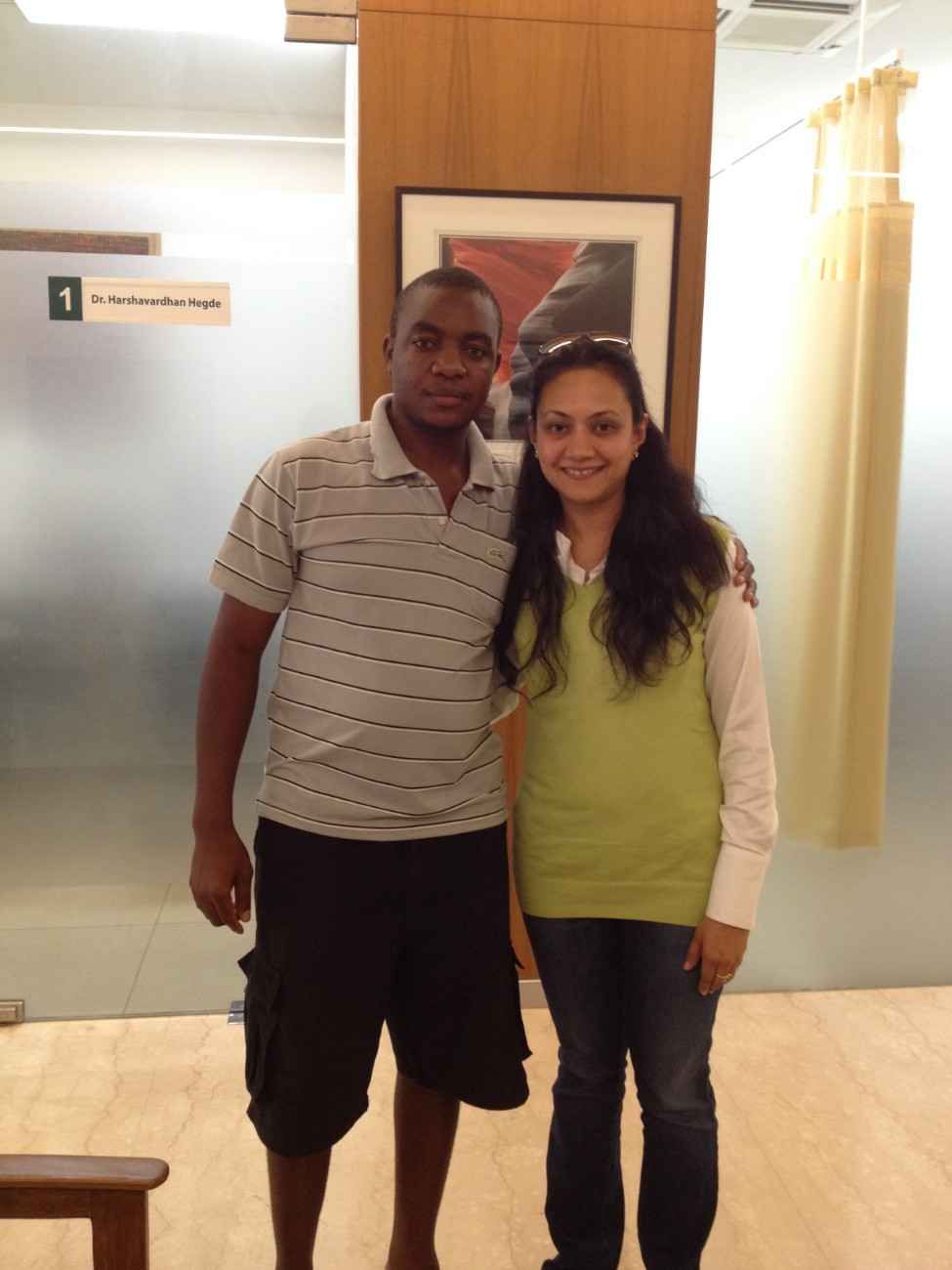 Patient with doctor after successful treatment in India