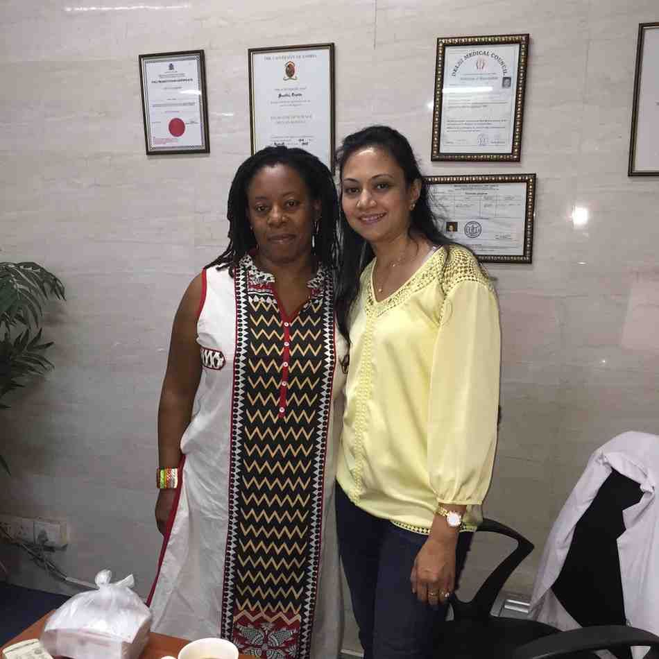 Patient with doctor after successful treatment in India