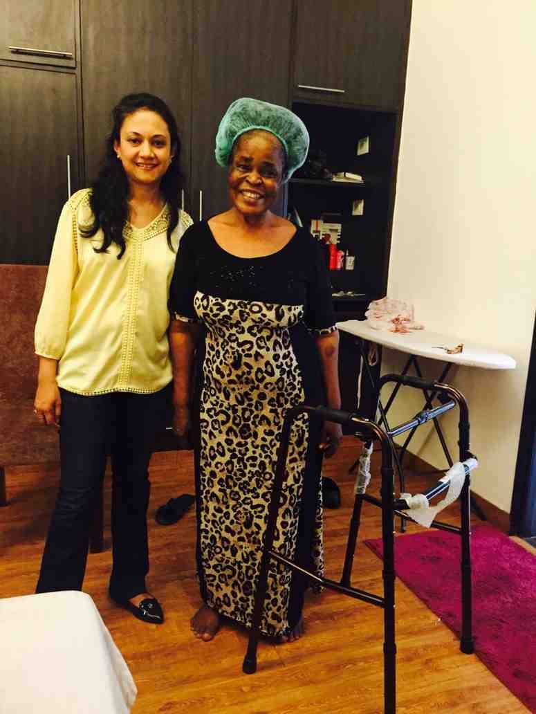 Patient with doctor after successful treatment in India