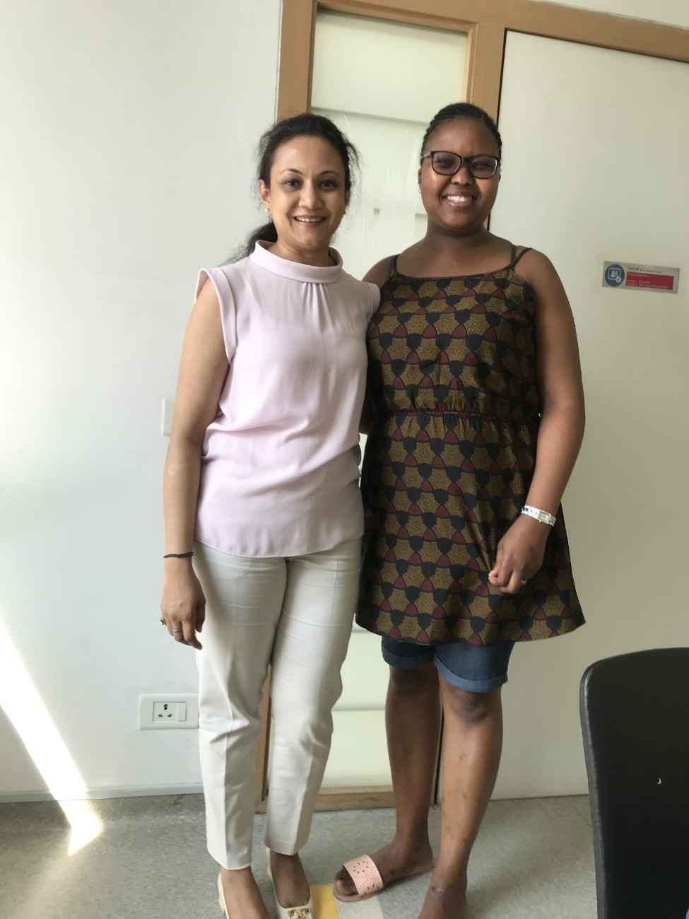 Patient with doctor after successful treatment in India