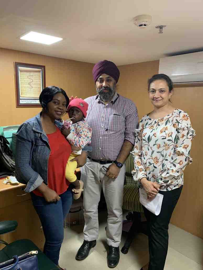 Patient with doctor after successful treatment in India