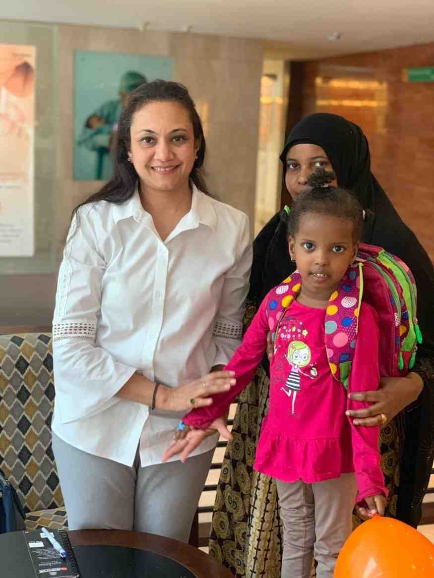 Patient with doctor after successful treatment in India