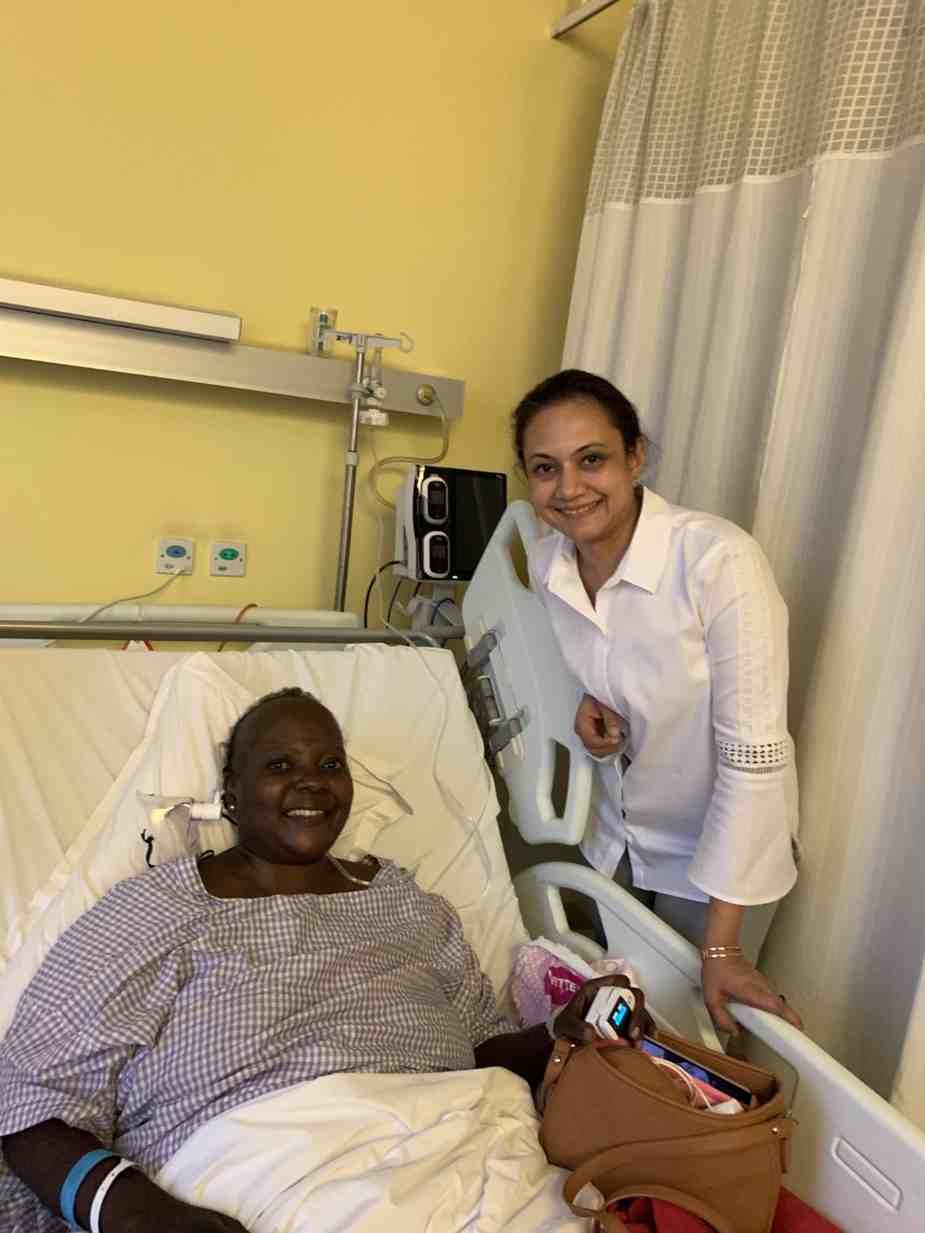 Patient with doctor after successful treatment in India