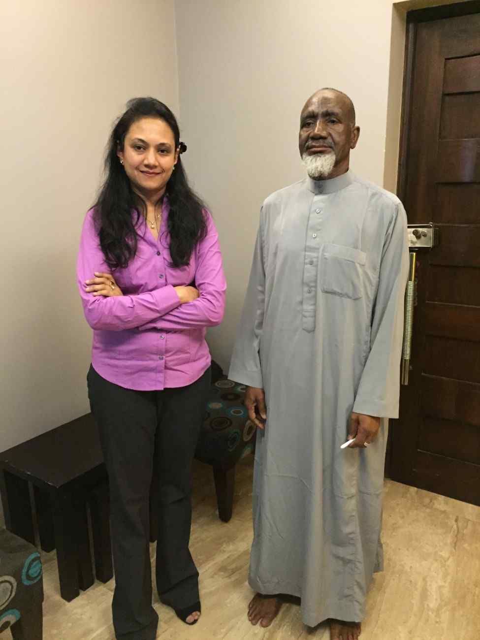 Patient with doctor after successful treatment in India