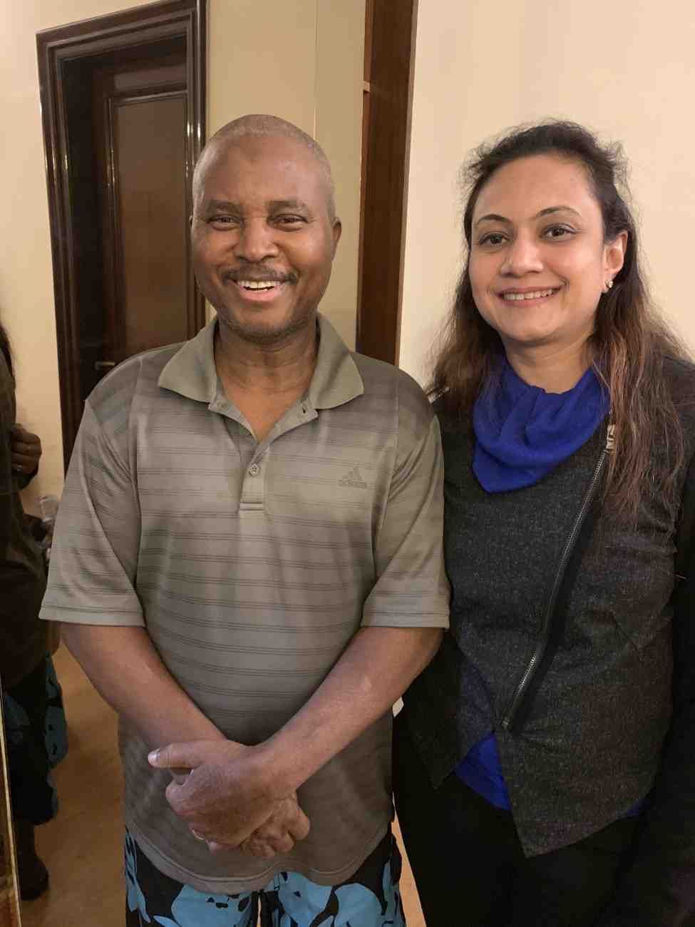 Patient with doctor after successful treatment in India