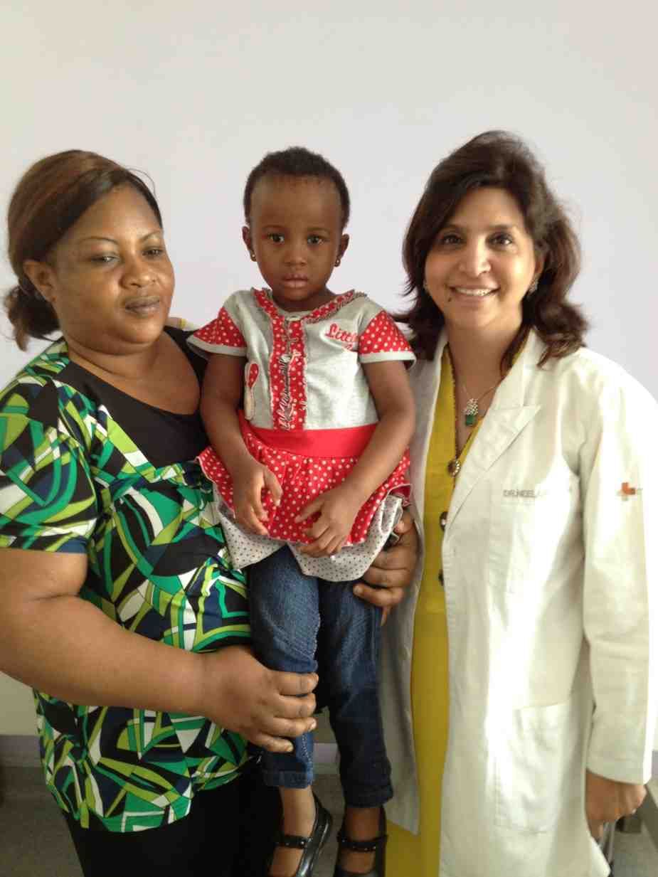 Patient with doctor after successful treatment in India