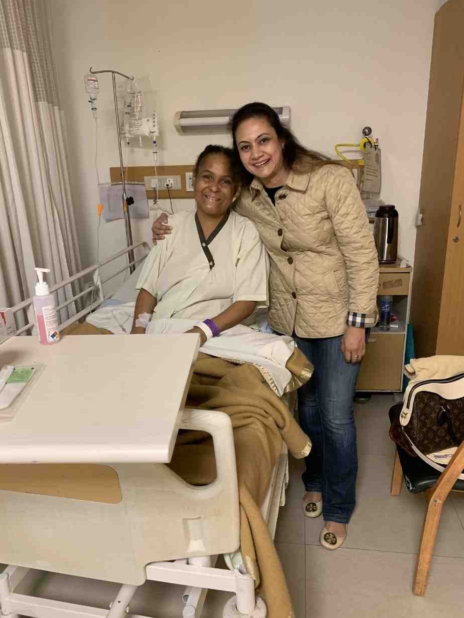 Patient with doctor after successful treatment in India