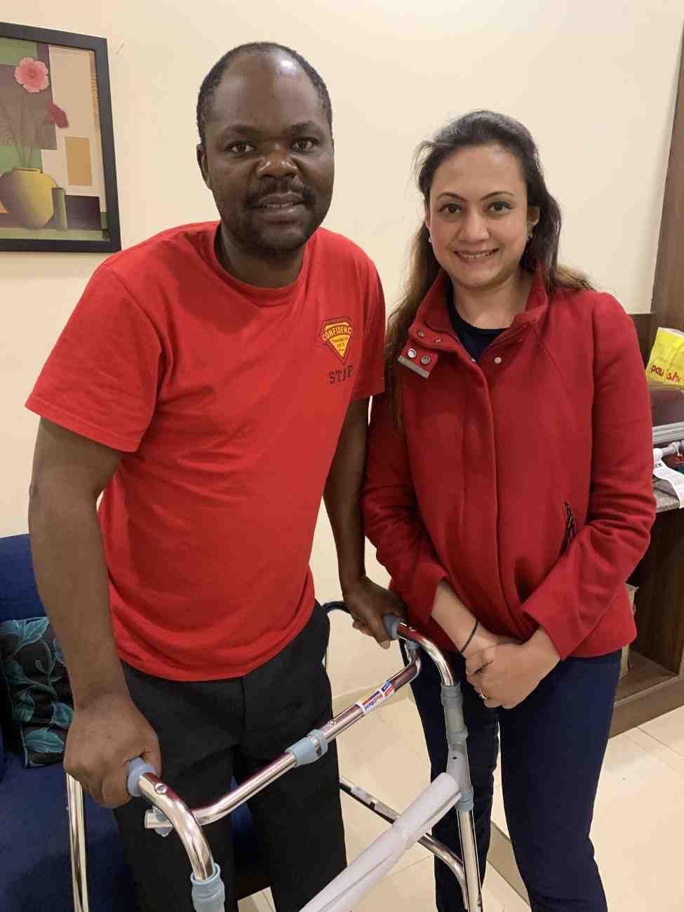 Patient with doctor after successful treatment in India