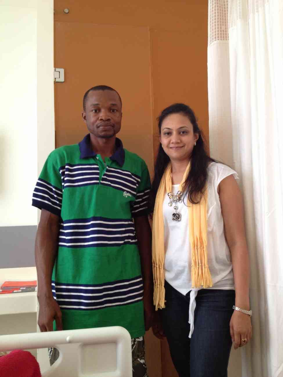 Patient with doctor after successful treatment in India