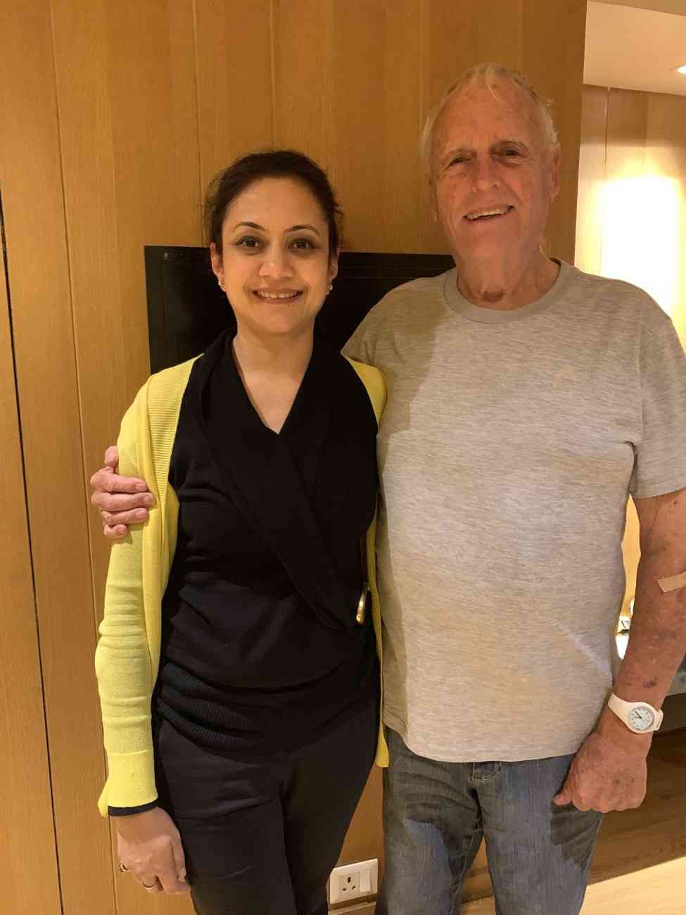 Patient with doctor after successful treatment in India