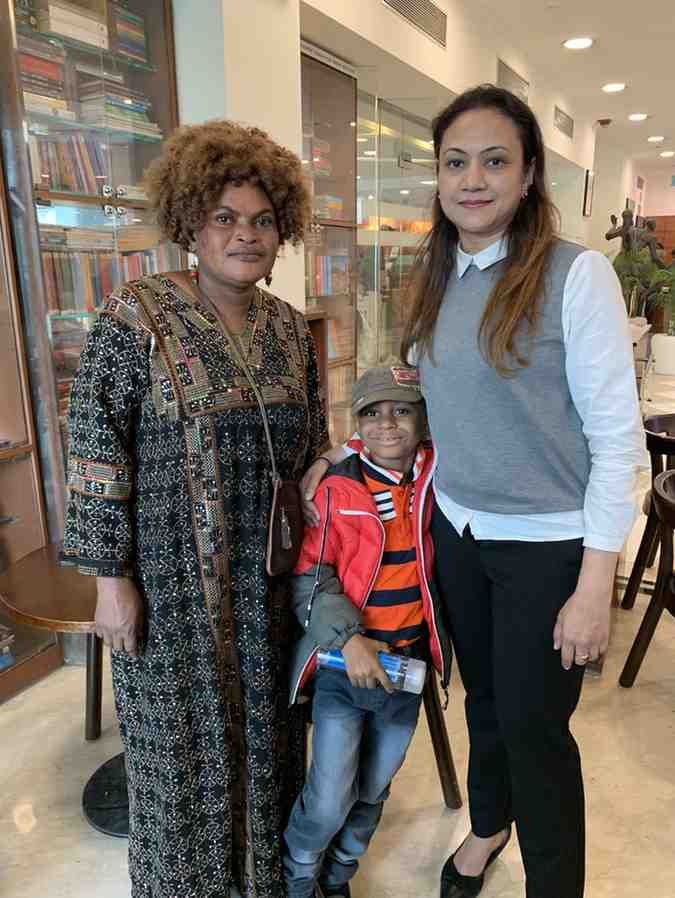 Patient with doctor after successful treatment in India