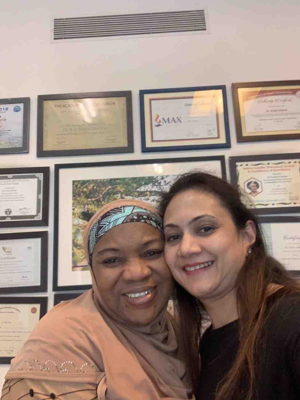 Patient with doctor after successful treatment in India