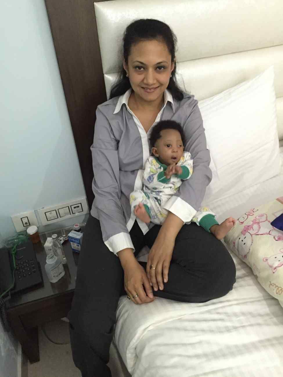 Patient with doctor after successful treatment in India