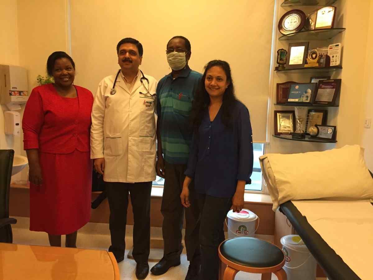 Patient with doctor after successful treatment in India