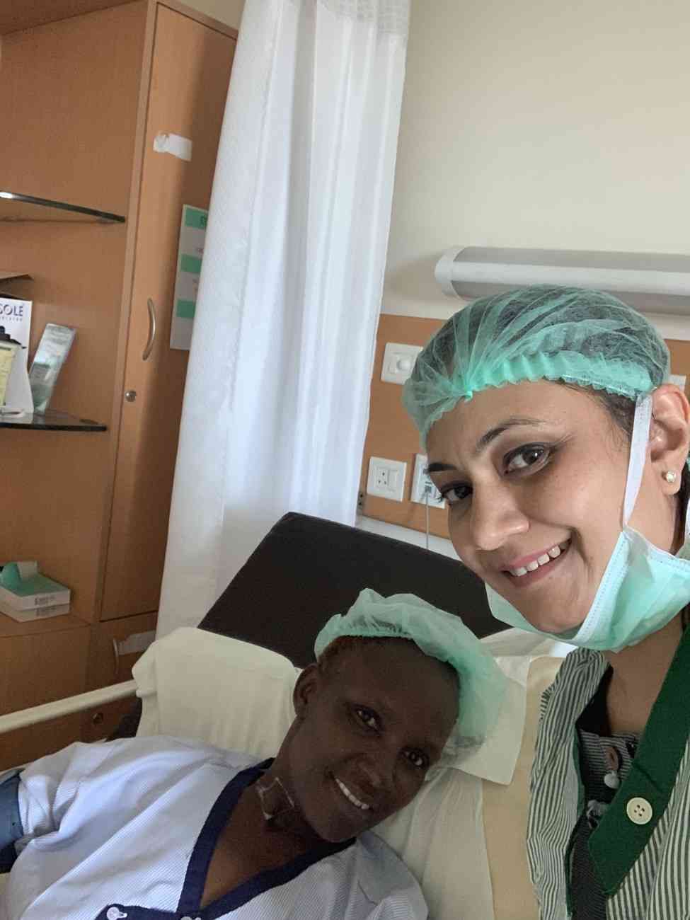 Patient with doctor after successful treatment in India