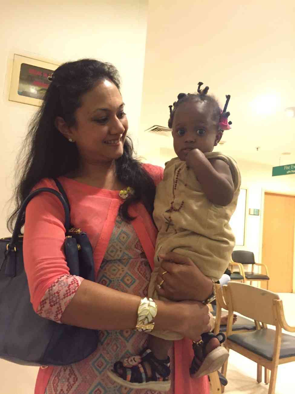 Patient with doctor after successful treatment in India