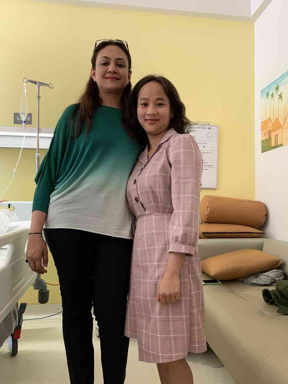 Patient with doctor after successful treatment in India