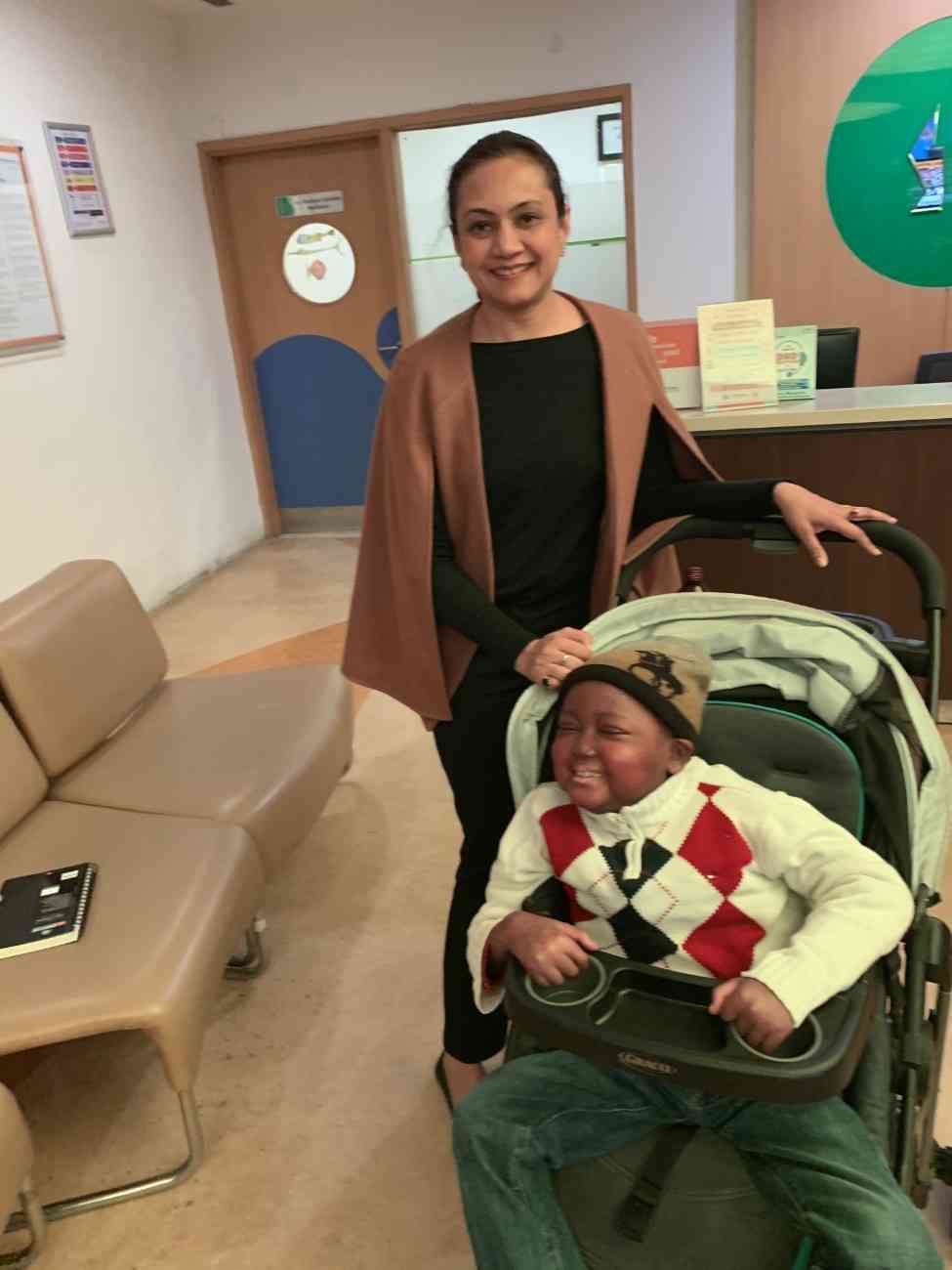 Patient with doctor after successful treatment in India