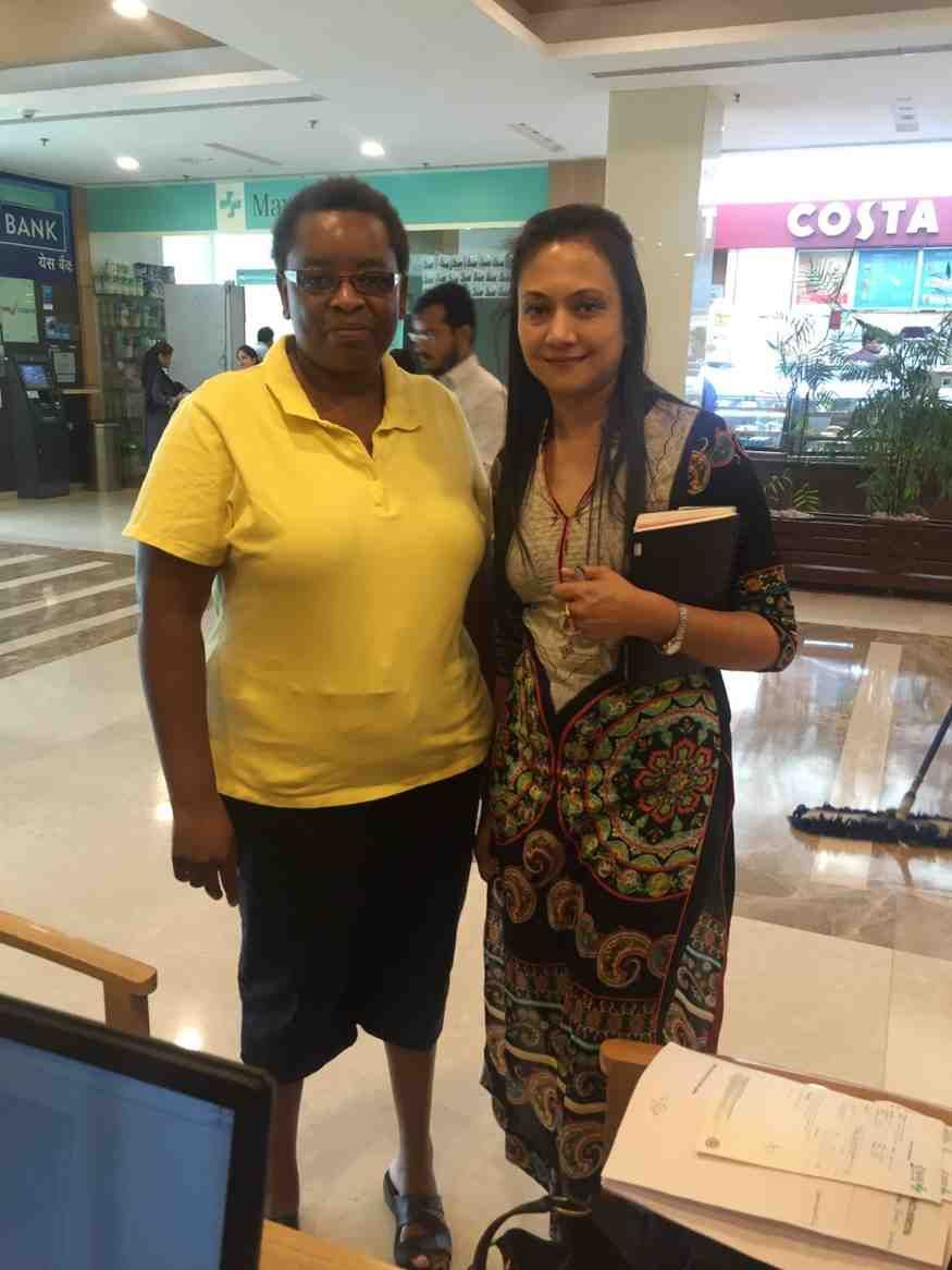 Patient with doctor after successful treatment in India