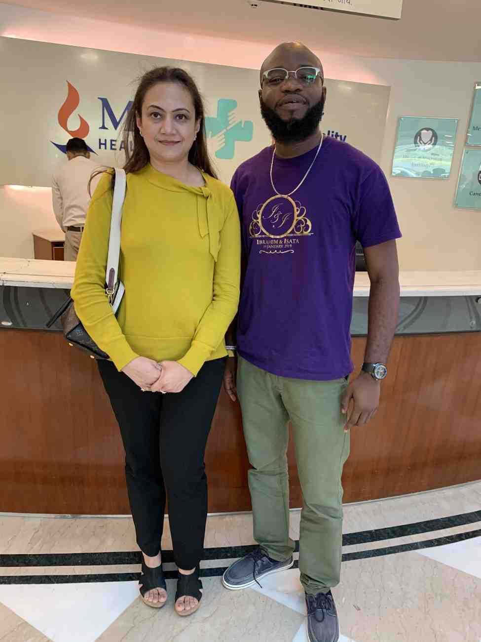 Patient with doctor after successful treatment in India