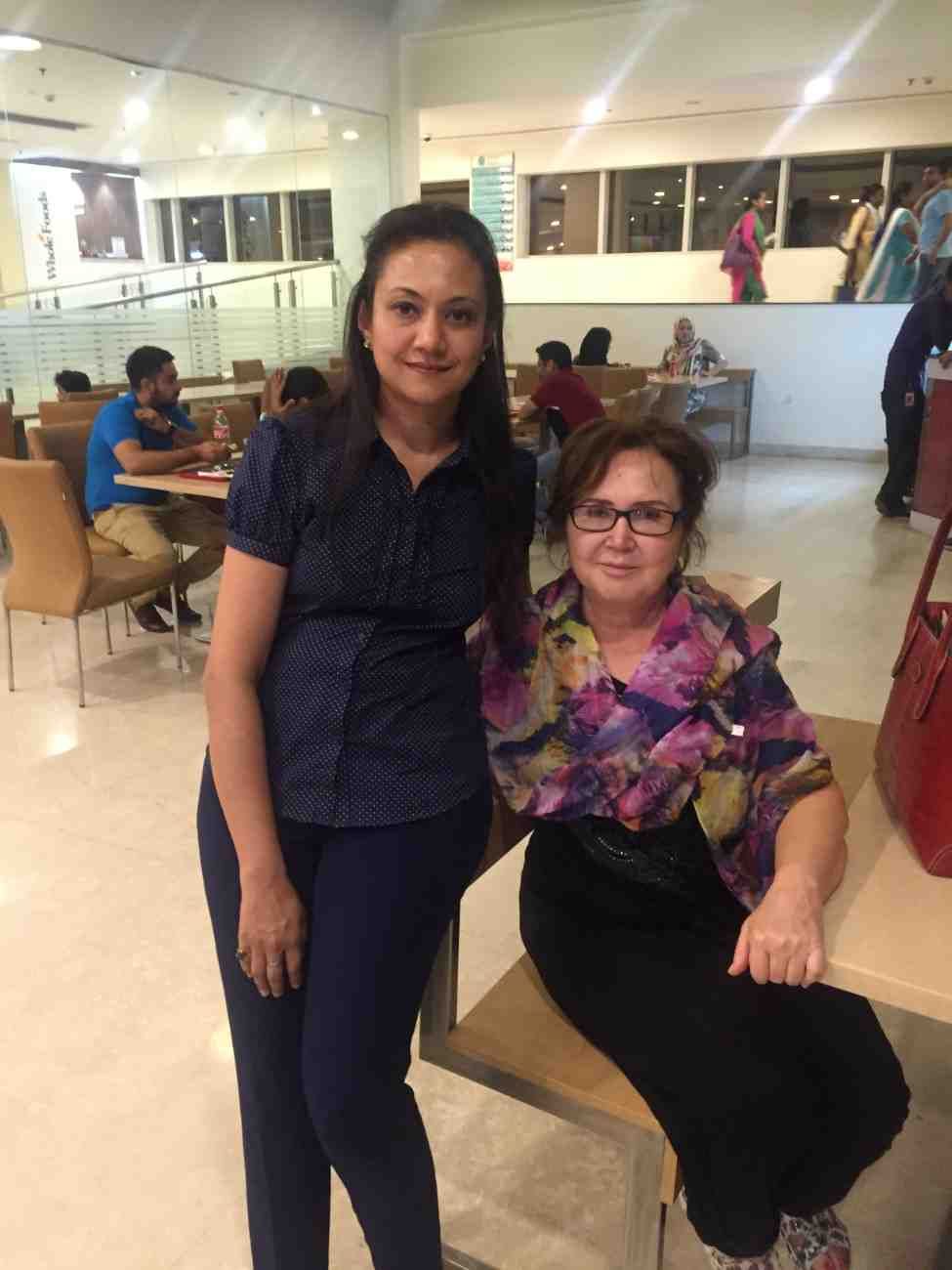 Patient with doctor after successful treatment in India