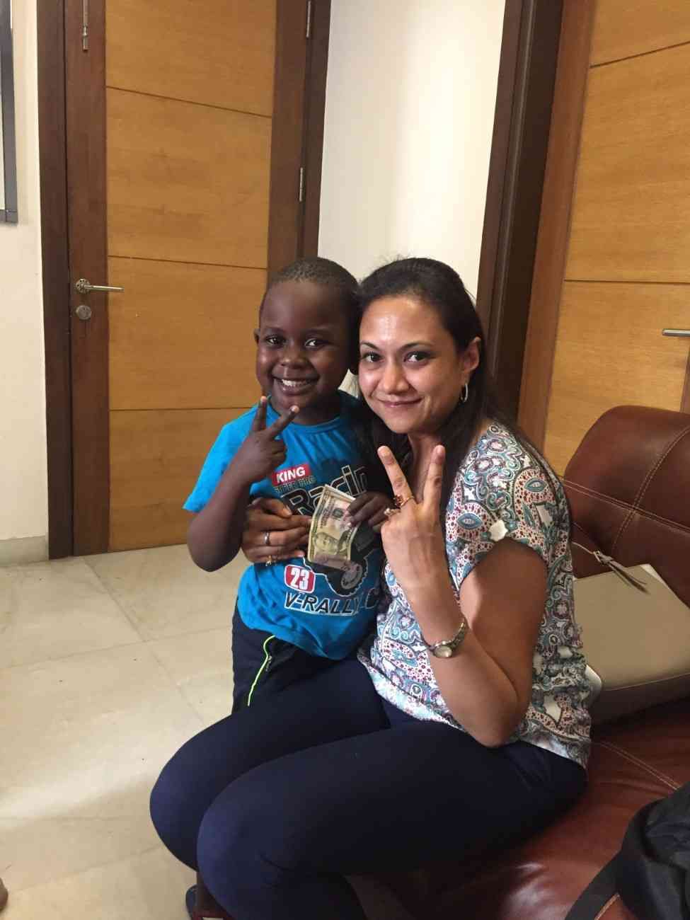 Patient with doctor after successful treatment in India