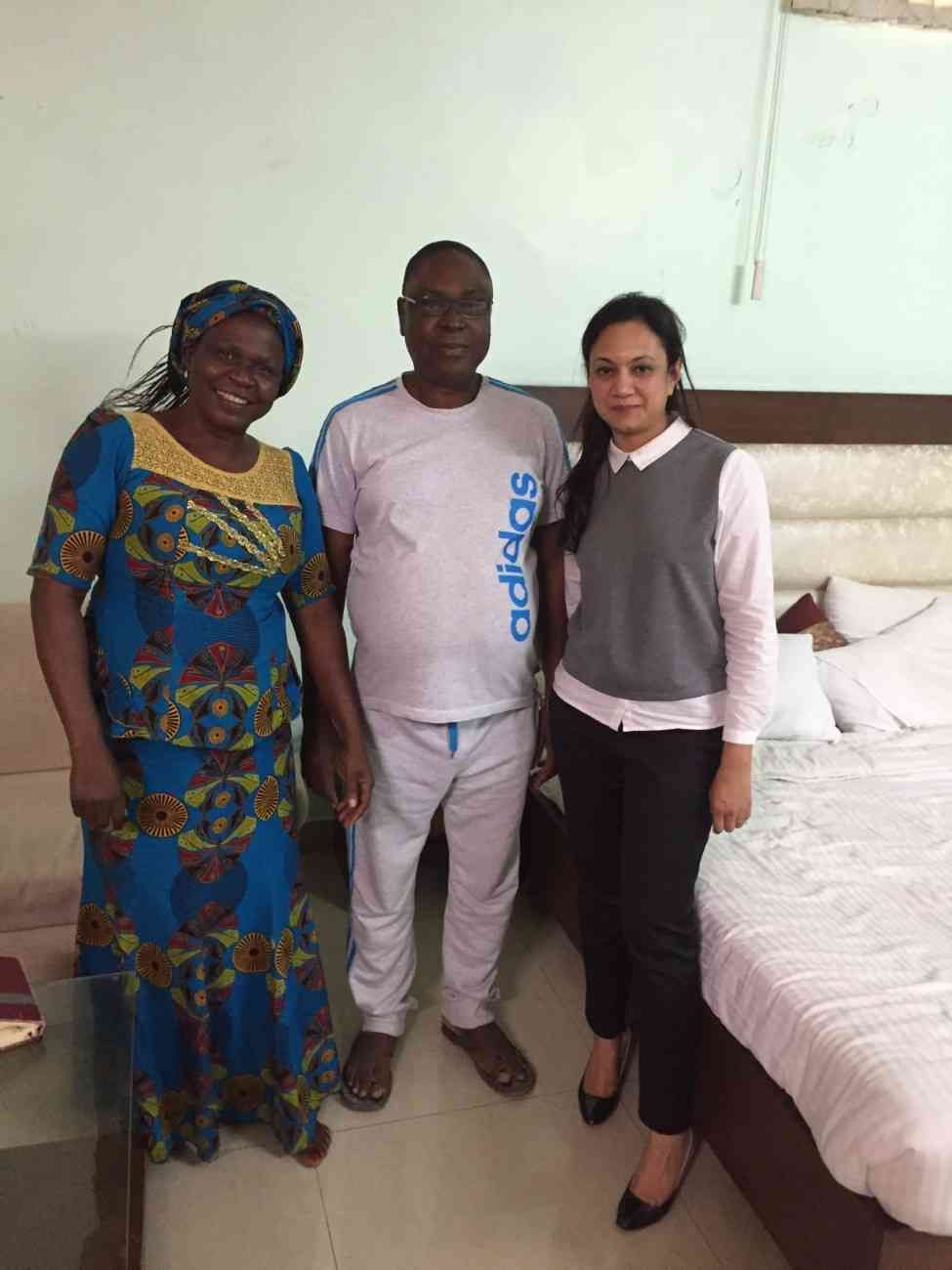 Patient with doctor after successful treatment in India