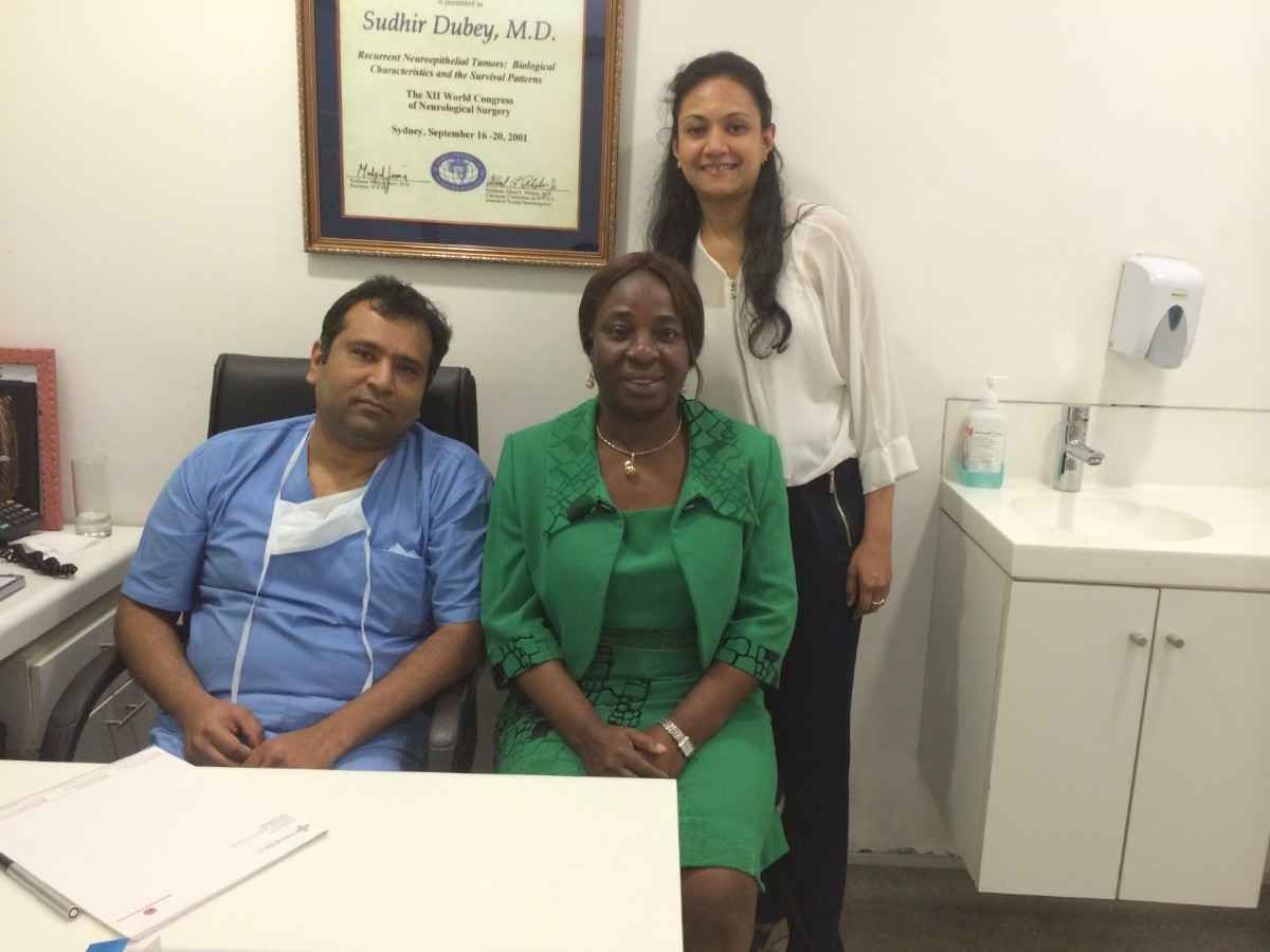 Patient with doctor after successful treatment in India