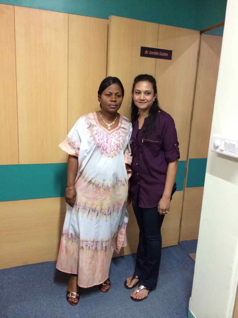 Patient with doctor after successful treatment in India